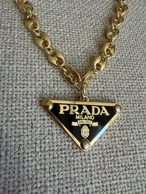 Prada Gold and Black Triangle Logo Necklace